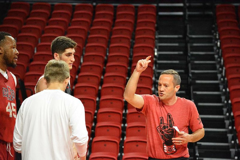 Arkansas State's basketball coach Grant McCasland (right) is shown in this file photo.