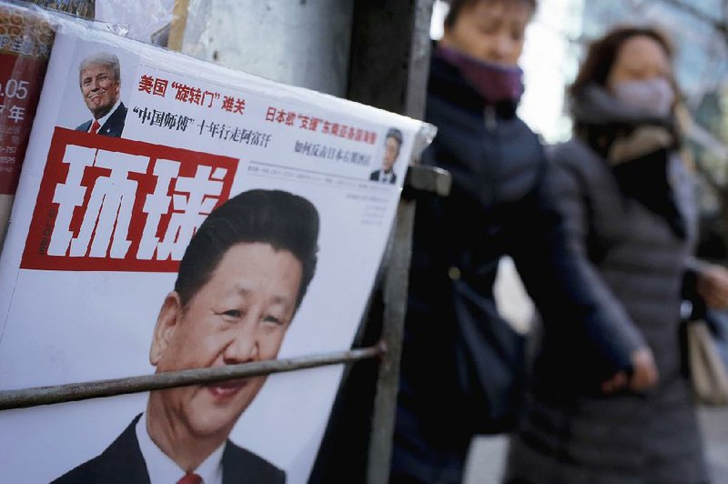 Chinese President Xi Jinping and U.S. President Donald Trump are on the cover of a news magazine on display Thursday in Beijing. 
