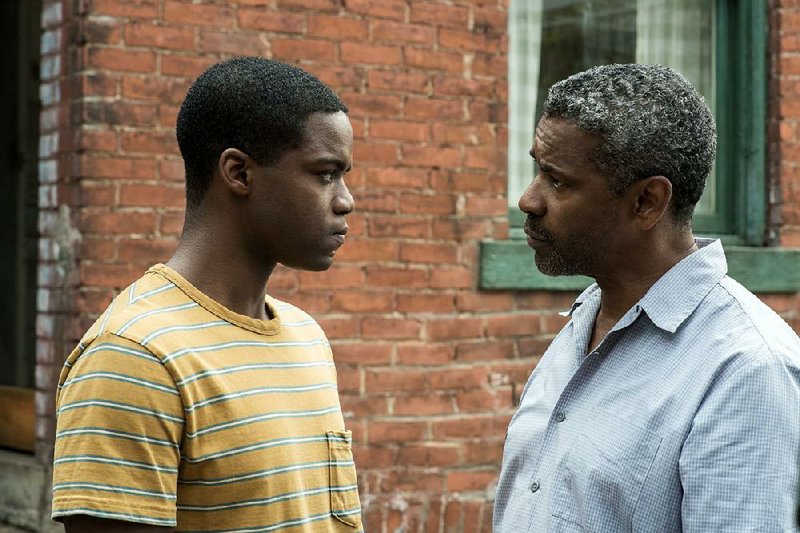 Jovan Adepo and Denzel Washington in a scene from Fences, Washington’s adaptation of August Wilson’s classic play.