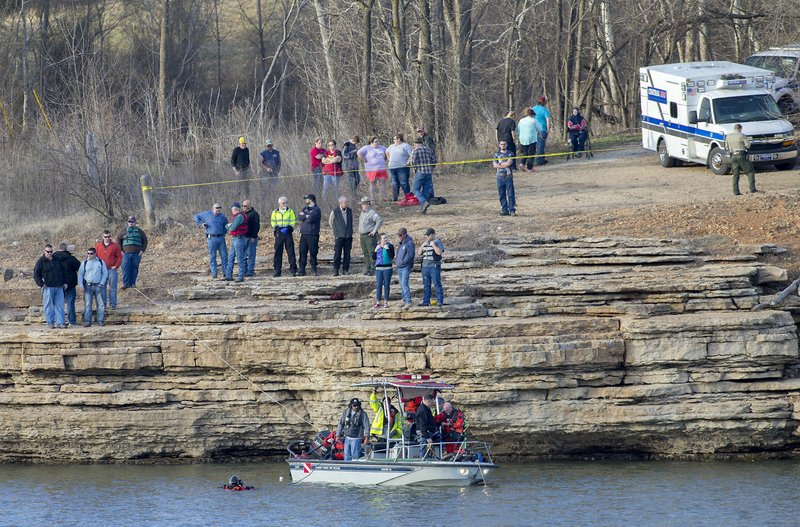 Crews work a search and rescue for a vehicle and an occupant Friday on Beaver Lake off Saddle Shop Lane near U.S. 412 in Springdale. Clifford Collins, 16, drowned. His was found about 5:30 p.m. by divers.