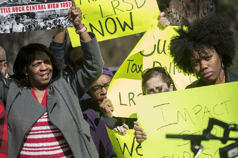 Nanette Edgeston (left) and other parents, community members, clergymen and state and city officials demonstrate Friday outside Franklin Elementary School to protest the decision to close the Little Rock school. Two other schools will also be closed, state education officials decided Thursday.