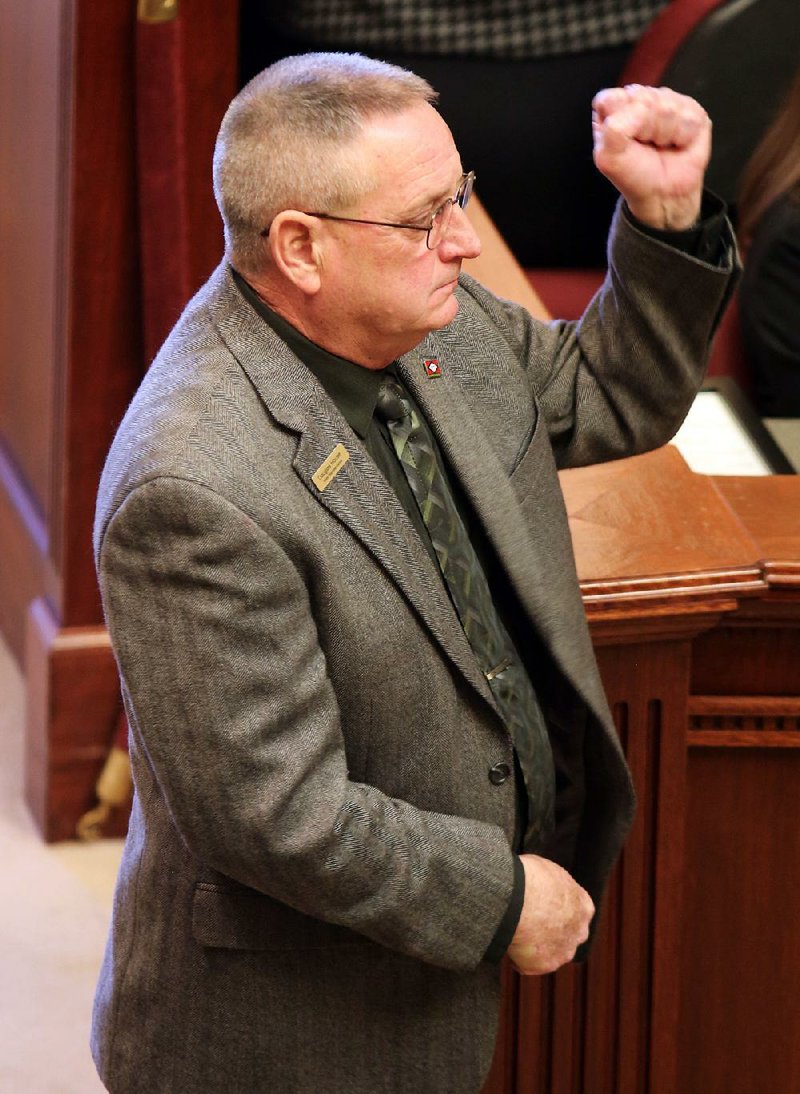 Rep. Doug House gestures Friday regarding House Bill 1369, one of five medical-marijuana measures he sponsored. All were approved in the House.