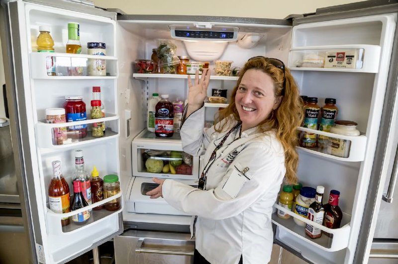 Chef Jolie Mosley, lead culinary instructor at Pulaski Technical College’s Culinary Arts and Hospitality Management Institute in Little Rock, shows how to organize a refrigerator for safety and convenience. The basic idea: Organize according to the coldest shelves, and raw meat goes on the bottom.