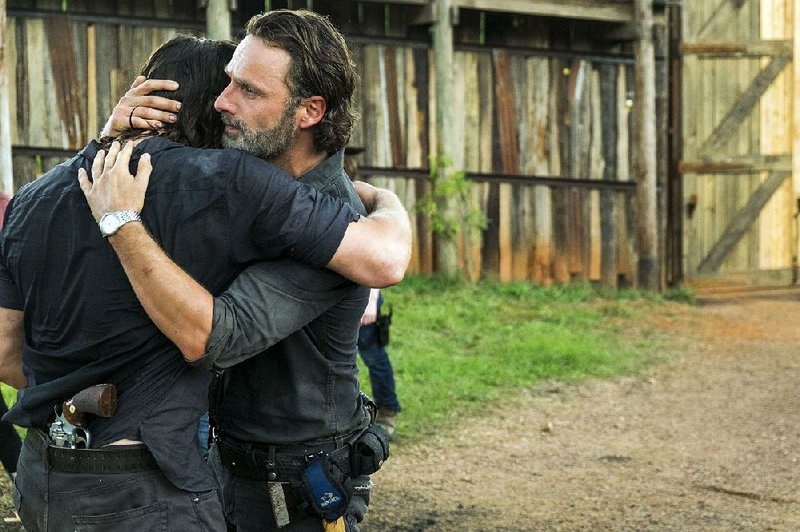 The Walking Dead’s moment of Zen: Rick (right, Andrew Lincoln) is reunited with Daryl (Norman Reedus) in the Season 7 midseason finale. The series returns at 8 p.m. today on AMC.
