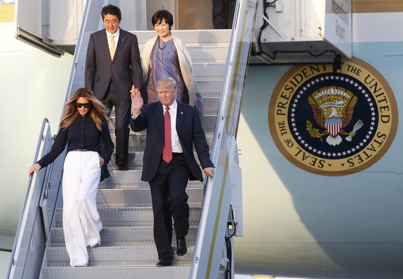 President Donald Trump and first lady Melania Trump Japanese Prime Minister Shinzo Abe and his wife Akie Abe step off of Air Force One as they arrive in West Palm Beach, Fla., Friday, Feb. 10, 2017. (AP Photo/Wilfredo Lee)