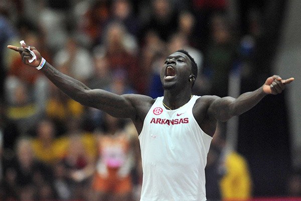 Arkansas senior Clive Pullen celebrates Saturday, Feb. 11, 2017, after winning the triple jump competition during the Tyson Invitational in the Randal Tyson Track Center in Fayetteville.