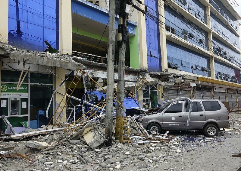 Debris from a building is shown Saturday after an earthquake struck the Philippines’ Surigao del Norte province Friday night.
