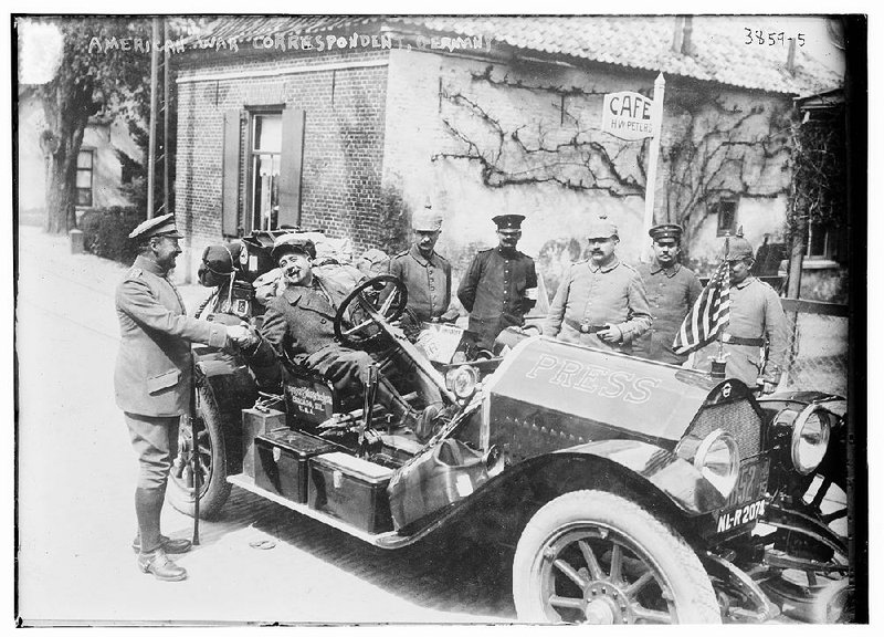 Wilbur Durborough, at the wheel of his Stutz Bearcat, chomps a cigar as he visits with German soldiers in this 1915 footage from his fi lm On the Firing Line With the Germans.