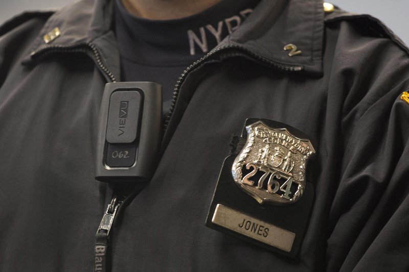 FILE - In this Dec. 3, 2014 file photo, New York Police Department officer Joshua Jones wears a VieVu body camera on his chest during a news conference in New York. 