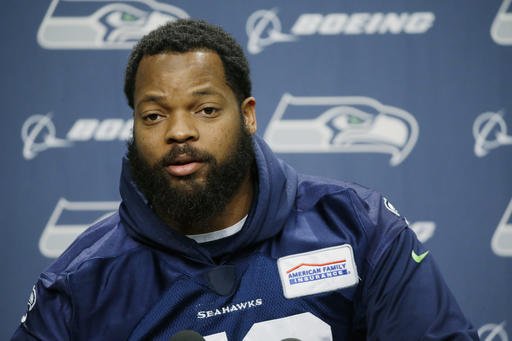 In this Jan. 10, 2017, file photo, Seattle Seahawks defensive end Michael Bennett talks to reporters in Renton, Wash. 