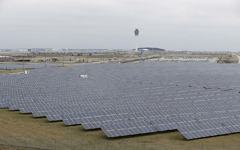 A solar farm sits at the Indianapolis International Airport. Utilities are promoting a program to sell or lease solar panels to customers.