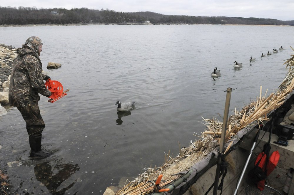 Hunter enjoys friend, retriever and ducks on hunts at Beaver Lake