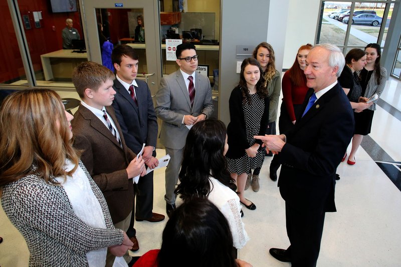 Governor Asa Hutchinson speaks Thursday, February 9, 2017, with students before a dedication ceremony for Springdale's new Don Tyson School of Innovation campus. 