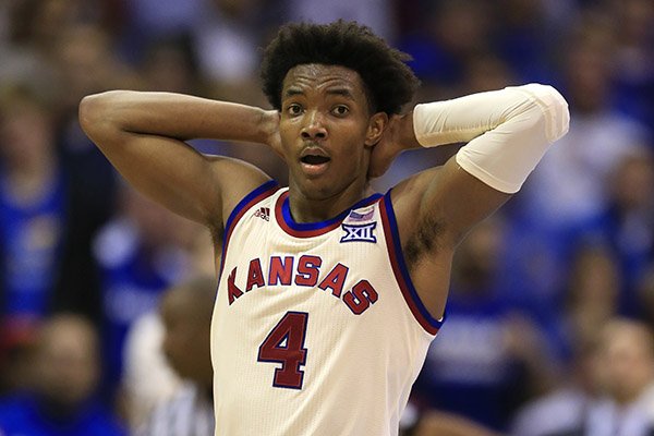 Kansas guard Devonte' Graham (4) during the second half of an NCAA college basketball game against West Virginia in Lawrence, Kan., Monday, Feb. 13, 2017. Kansas defeated West Virginia 84-80 in overtime. (AP Photo/Orlin Wagner)

