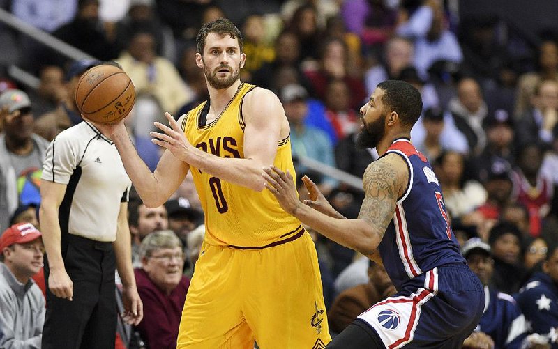 Cleveland Cavaliers forward Kevin Love (0) holds the ball against Washington Wizards forward Markieff Morris (5) during the second half of an NBA basketball game, Monday, Feb. 6, 2017, in Washington.