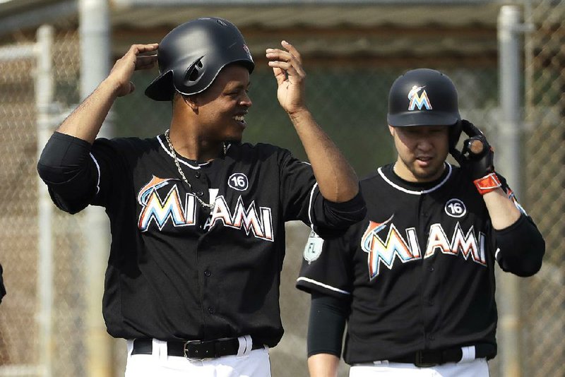 Pitcher Edinson Volquez (left) was one of the Miami Marlins players to take advantage of Manager Don Mattingly’s new policy of allowing players on the roster to sport facial hair.