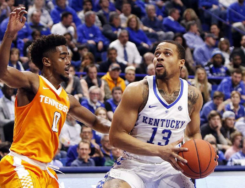 Kentucky guard Isaiah Briscoe (right) eyes the basket while Tennessee guard Jordan Bone defends during Tuesday night’s game at Rupp Arena in Lexington, Ky. Briscoe fi nished with 12 points, 6 assists and 4 rebounds as the Wildcats rolled to an 83-58 victory to avenge a loss to the Volunteers on Jan. 24.