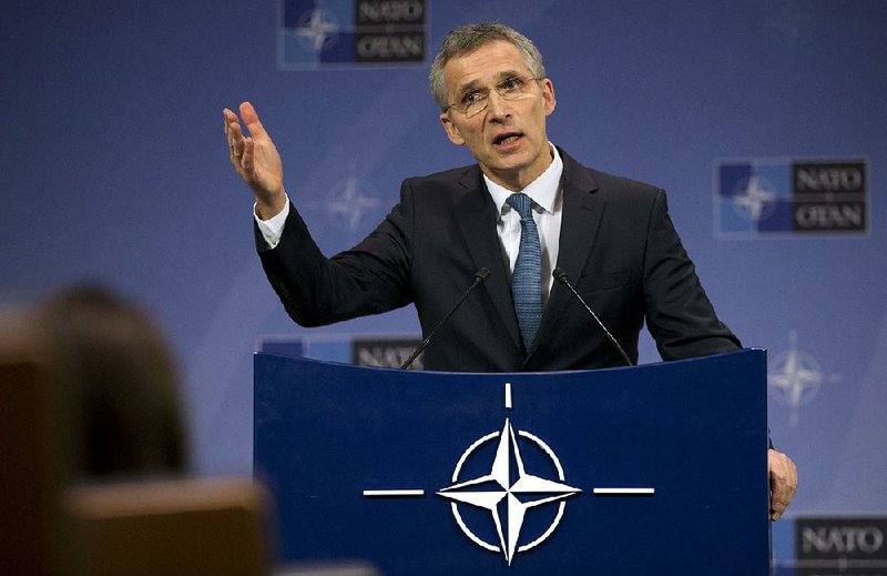 NATO Secretary-General Jens Stoltenberg speaks during a news conference at NATO headquarters in Brussels on Tuesday.