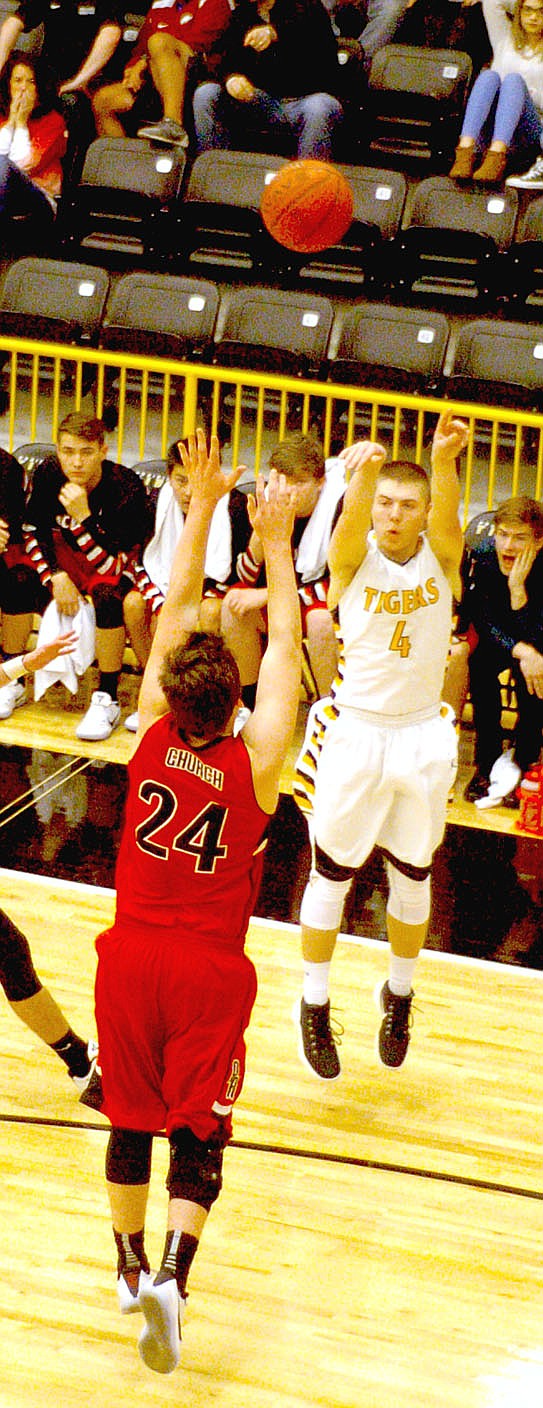 Photo by Mark Humphrey/Enterprise-Leader/Prairie Grove senior Zeke Laird hit four 3-pointers, scoring 14 points in the Tigers&#8217; 59-56 upset of conference co-leader Pea Ridge Feb. 7.