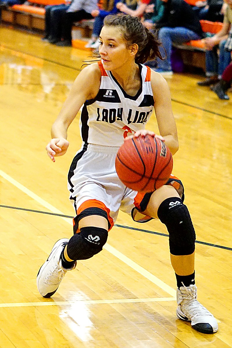 Photo by Randy Moll Tori Foster, junior point guard for the Gravette Lady Lions, brings the ball down court during a home game earlier this season.