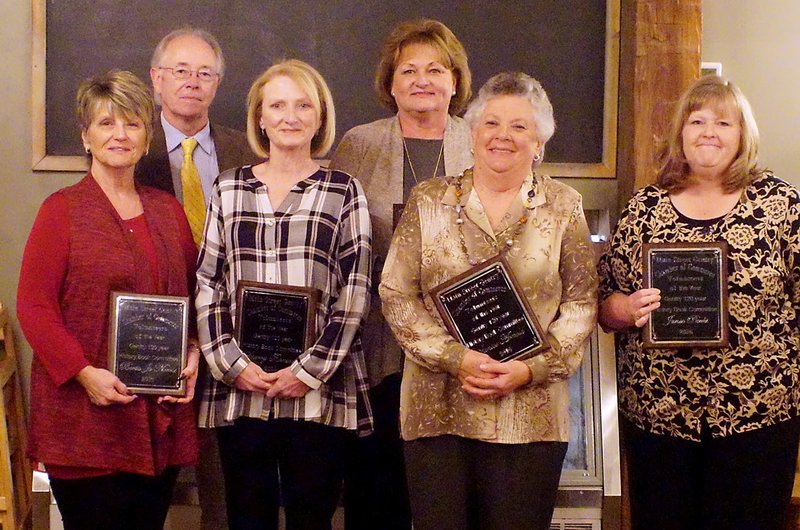 Photo by Randy Moll The Gentry History Book Committee, consisting of Berta Jo Norris (left), Rick Parker, Sherry Ransom, Marla England, Janice Arnold and Janie Parks, was awarded for all the volunteer hours which went into the creation of the new Gentry History Book during the Gentry Chamber of Commerce awards banquet on Thursday at the Wooden Spoon Restaurant in Gentry.