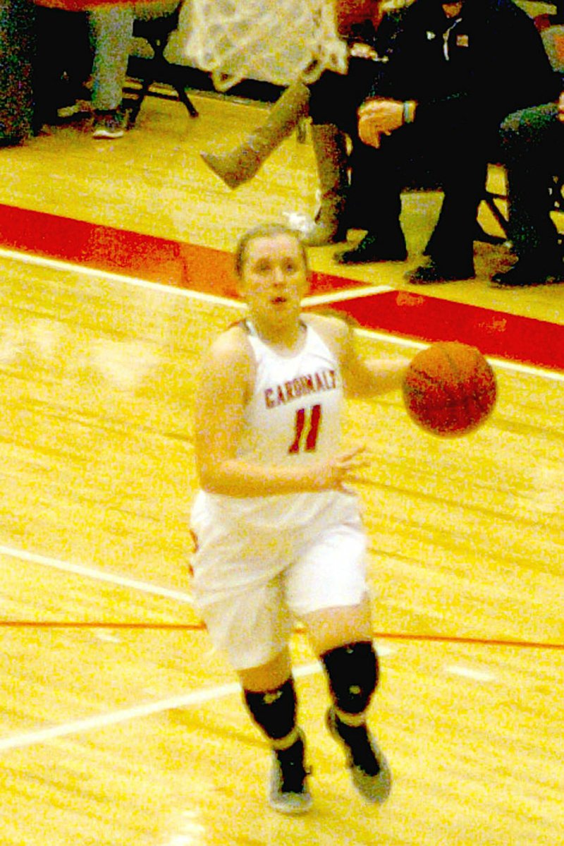Photo by Mark Humphrey/Enterprise-Leader/Farmington senior Camryn Journagan goes to the basket on the fast-break. The Lady Cardinals defeated Alma, 58-54, in overtime Friday.