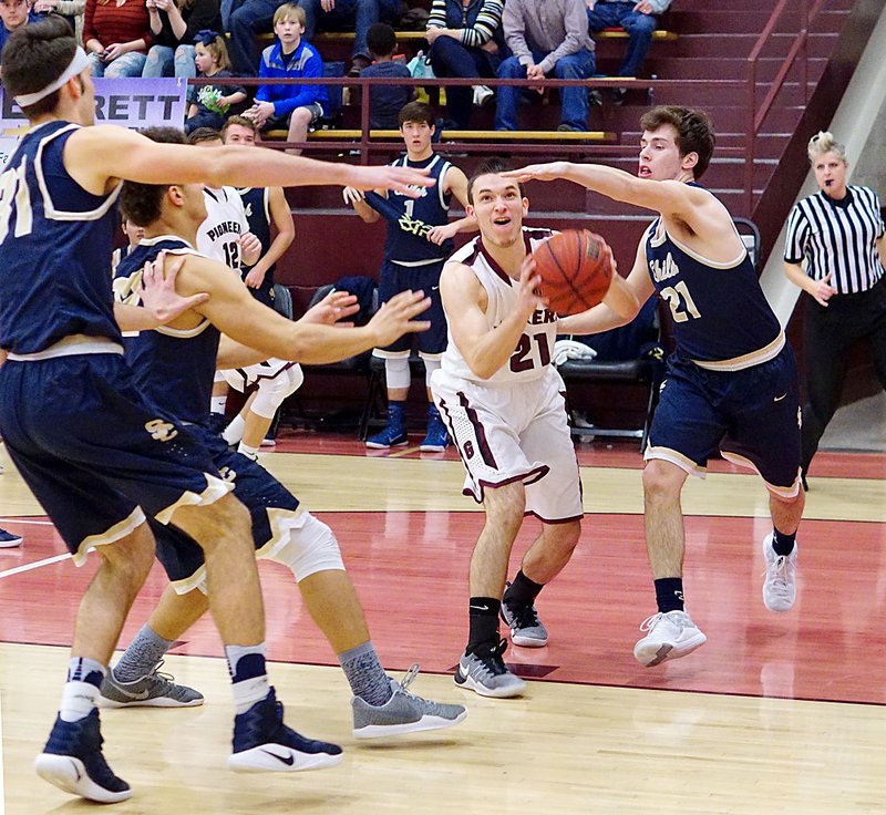 Photo by Randy Moll Surrounded by Shiloh Christian defenders, Gentry&#8217;s Evan Folker looks to shoot for two under the basket during Friday&#8217;s game between the two teams at Gentry High School.