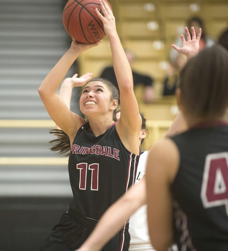 NWA Democrat-Gazette/J.T. WAMPLER Sprindale High’s Haley Dougan shoots against Bentonville High on Tuesday. Dougan made a 3-pointer at the final buzzer to give Springdale the victory.