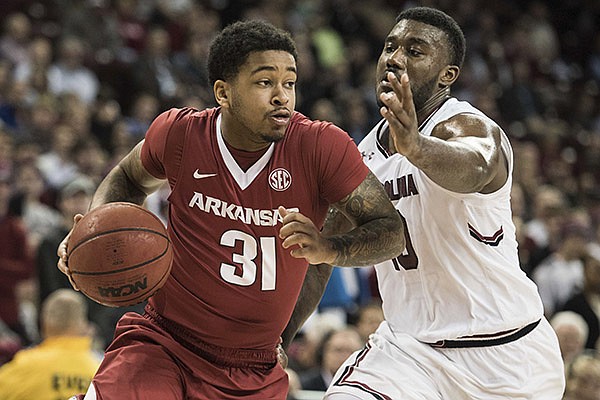 Arkansas guard Anton Beard (31) drives to the hoop against South Carolina guard Duane Notice (10) during the second half of an NCAA college basketball game, Wednesday, Feb. 15, 2017, in Columbia, S.C. Arkansas defeated South Carolina 83-76. (AP Photo/Sean Rayford)

