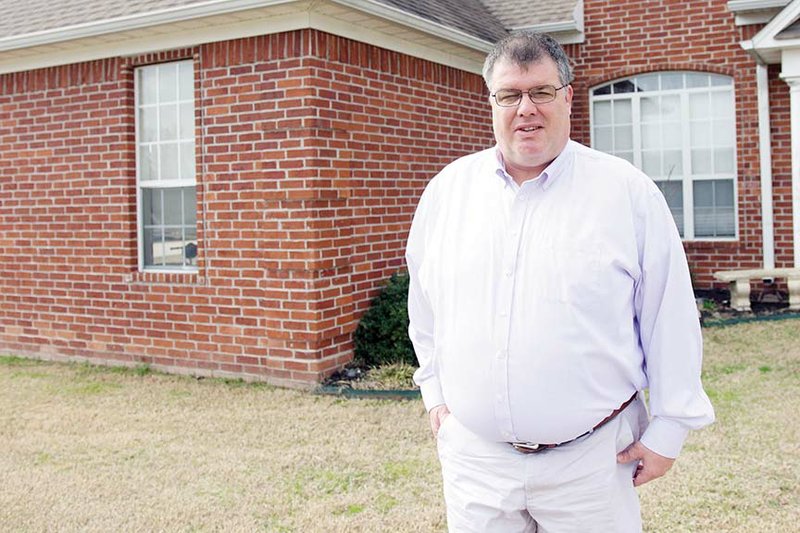 Shade Gilbert stands outside his home in Conway. Gilbert was hired earlier this month as the new superintendent of the Guy-Perkins School District. He is in his second year as a principal in the Nemo Vista School District.