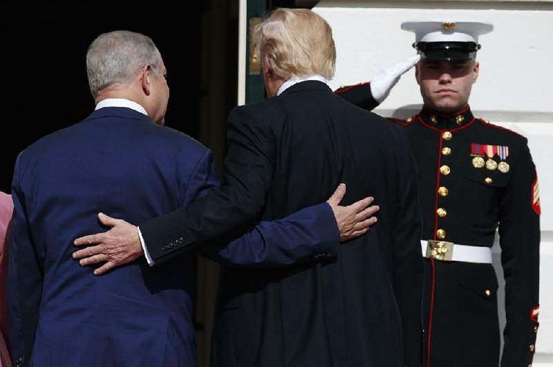 Israeli Prime Minister Benjamin Netanyahu is escorted into the White House on Wednesday by President Donald Trump.