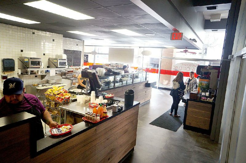 A face-lift for Bray Gourmet Deli, in the Catlett-Prein Tower building, 323 Center St., Little Rock, includes new floors, countertops and a paint job and walnut planking around the countertops.
