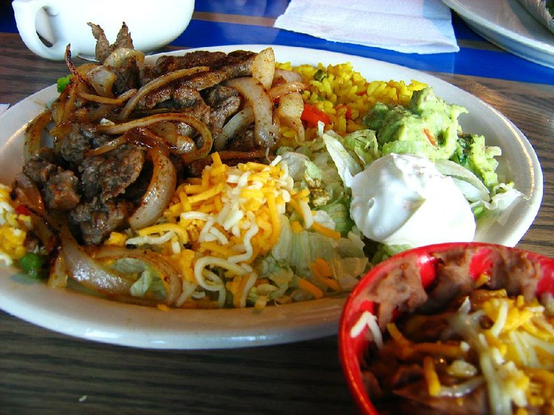 The Beef Fajita Plate at Fuzzy’s Taco Shop in Jacksonville comes with sliced grilled beef, onions, green peppers and tortillas, as well as guacamole, lettuce, sour cream, shredded cheese, pico de gallo and a choice of two sides. 