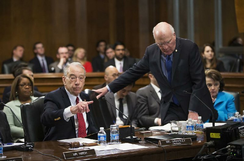 Senate Judiciary Committee Chairman Charles Grassley, R-Iowa, left, the committee's ranking member Sen. Patrick Leahy, D-Vt., center, and Sen. Dianne Feinstein, D-Calif., right, are shown in this 2016 file photo.