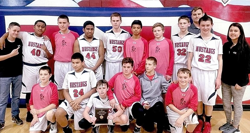 Photo submitted The McDonald County seventh-grade boys basketball team capped off a perfect 16-0 season by winning the Big 8 Conference Junior High Boys Basketball Tournament with a 37-30 victory over East Newton on Feb. 9 at East Newton High School.