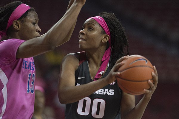 Arkansas' Jessica Jackson eyes the basket while Kentucky's Evelyn Akhator defends during the second half of a game Thursday Feb. 16, 2017, at Bud Walton Arena in Fayetteville. The Wildcats won 69-62.