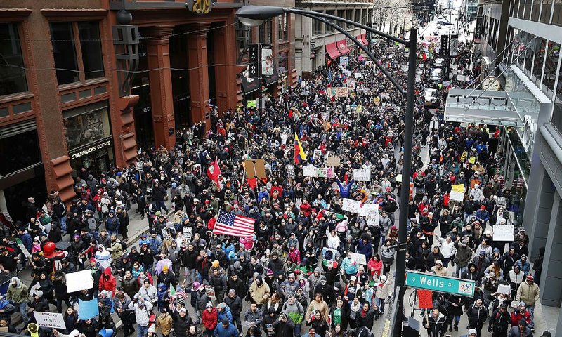 More than 1,000 people participate in a Chicago march as protests around the country Thursday took aim at President Donald Trump’s efforts to crack down on immigration.