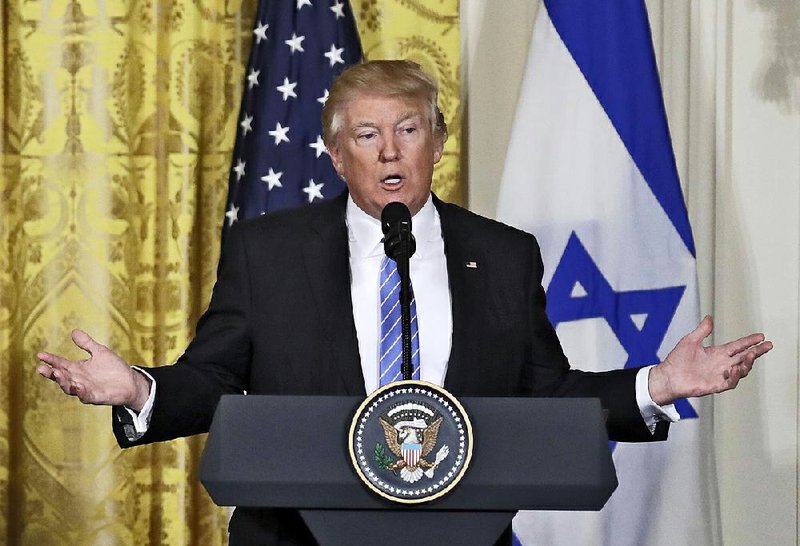 President Donald Trump, in a White House appearance Wednesday with Israeli Prime Minister Benjamin Netanyahu, ignored shouted questions about whether his advisers were in touch with Russian officials.