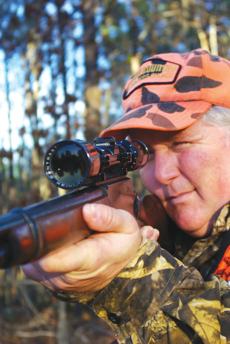 Many deer hunters have no idea who developed commonly used equipment such as the rifle scope, being used here by Alex Hinson of Paron.