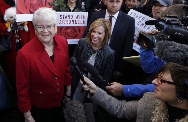  In this Nov. 15, 2016, file photo, Barronelle Stutzman, left, a Richland, Wash., florist who was fined for denying service to a gay couple in 2013, smiles as she is surrounded by supporters after a hearing before Washington's Supreme Court in Bellevue, Wash. 