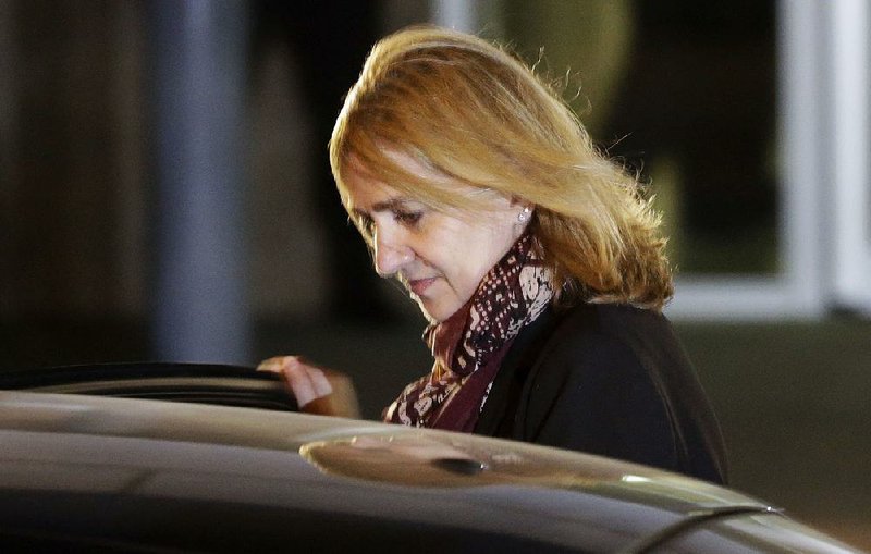 In this Jan. 11, 2016 file photo, Spain's Princess Cristina leaves a courtroom during a corruption trial, in Palma de Mallorca, Spain. 
