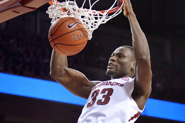 Moses Kingsley of Arkansas dunks against Ole Miss in the second half Saturday, Feb. 18, 2017, during the game at Bud Walton Arena in Fayetteville.