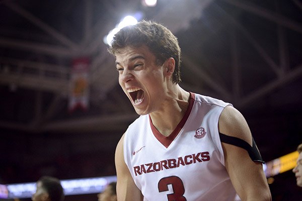 Dusty Hannahs of Arkansas celebrates as the Razorbacks close in on a victory over Ole Miss Saturday, Feb. 18, 2017, during the game at Bud Walton Arena in Fayetteville.
