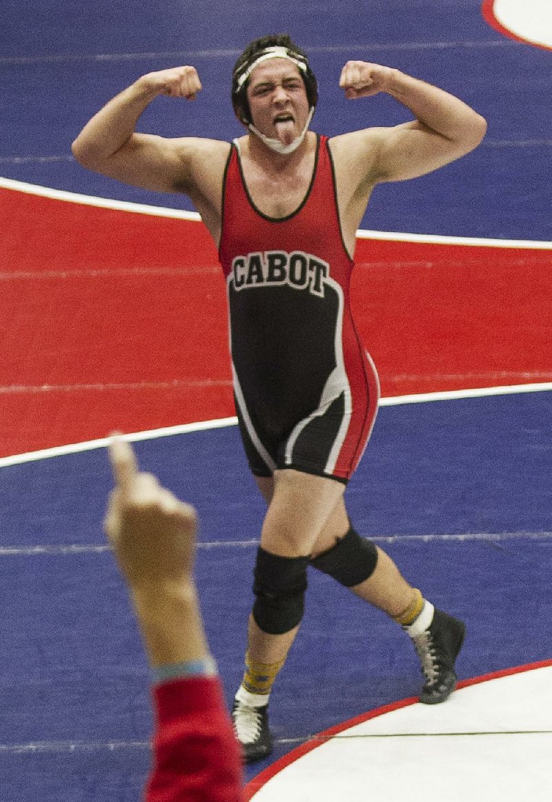 Cabot’s Harris Sutton celebrates a major decision over Tim Wooten of Rogers Heritage in the Class 6A/7A 220-pound championship Saturday at the Jack Stephens Center in Little Rock. Cabot finished 14th in the team competition, which was won by Bentonville. More photos at arkansasonline.com galleries.