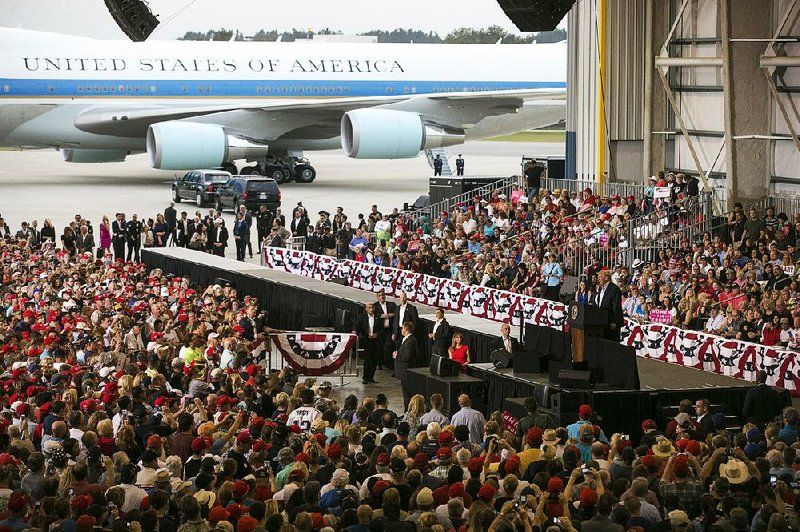 A cheering crowd packs a hangar Saturday at the Orlando Melbourne International Airport in Florida to hear President Donald Trump speak.