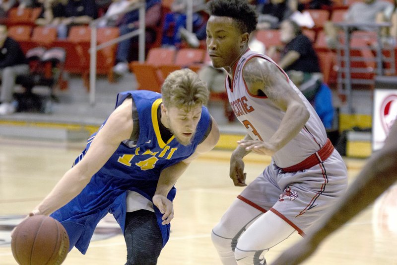 Photo submitted John Brown junior Jake Caudle drives the ball against Bacone (Okla.) on Thursday.