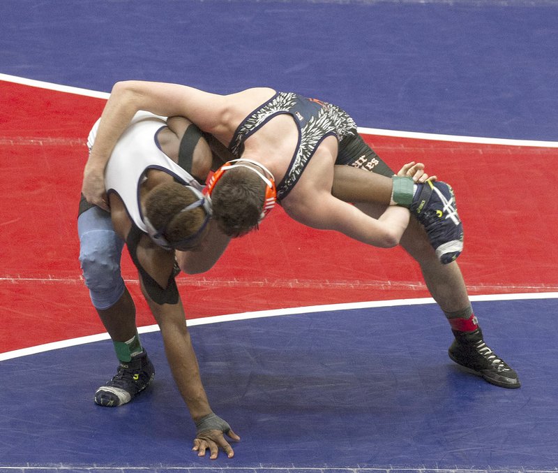 Rogers Heritage’s Chance McCrary (right) defeated Josh Tyler of Springdale Her-Ber in the Class 6A-7A 152-pound championship last season.