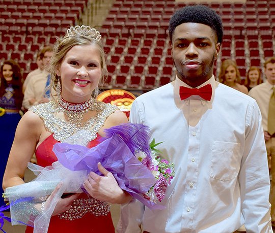 Submitted photo Megan Sliger, left, was named the queen of Lake Hamilton High School's basketball homecoming Feb. 3 when the Wolves hosted the Magnolia Panthers. She was escorted by Larenz Nero. The ceremony began with a Mardi Gras-style parade followed by the presentation of the court.
