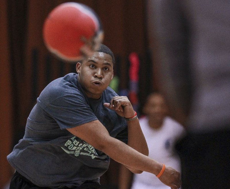 Taydrick Willis of team PU unleashes a mighty throw during a game in North Little Rock Parks and Recreation’s Adult Dodgeball League.