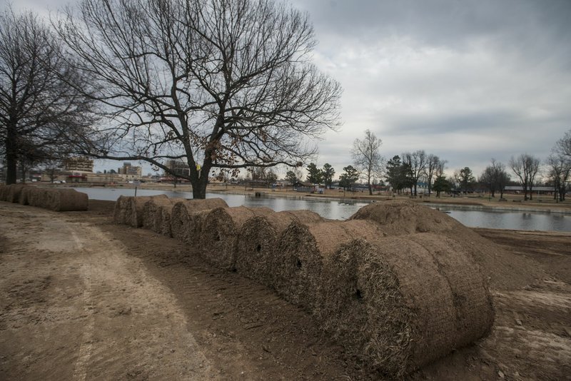 Sod waits to be rolled out Friday at Murphy Park in Springdale. Murphy Park has received improvements such as dredging the pond, a concrete bank and new pavilions among other improvements.